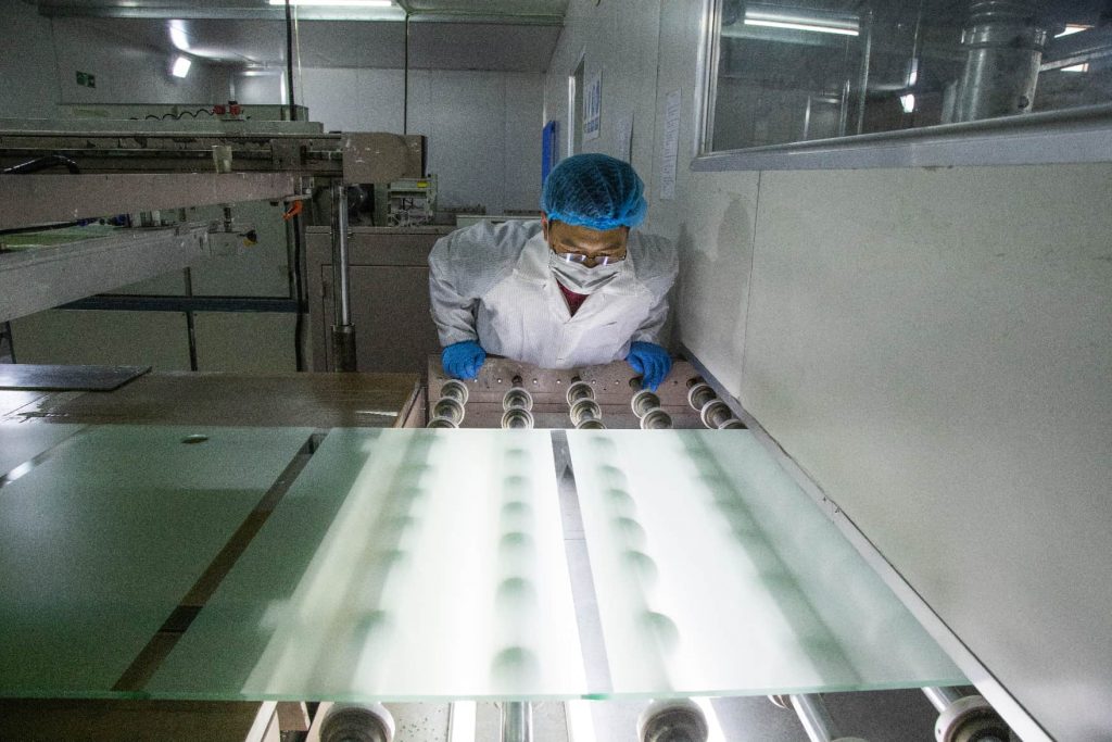 Workers on glass processing line 1024x683.jpg