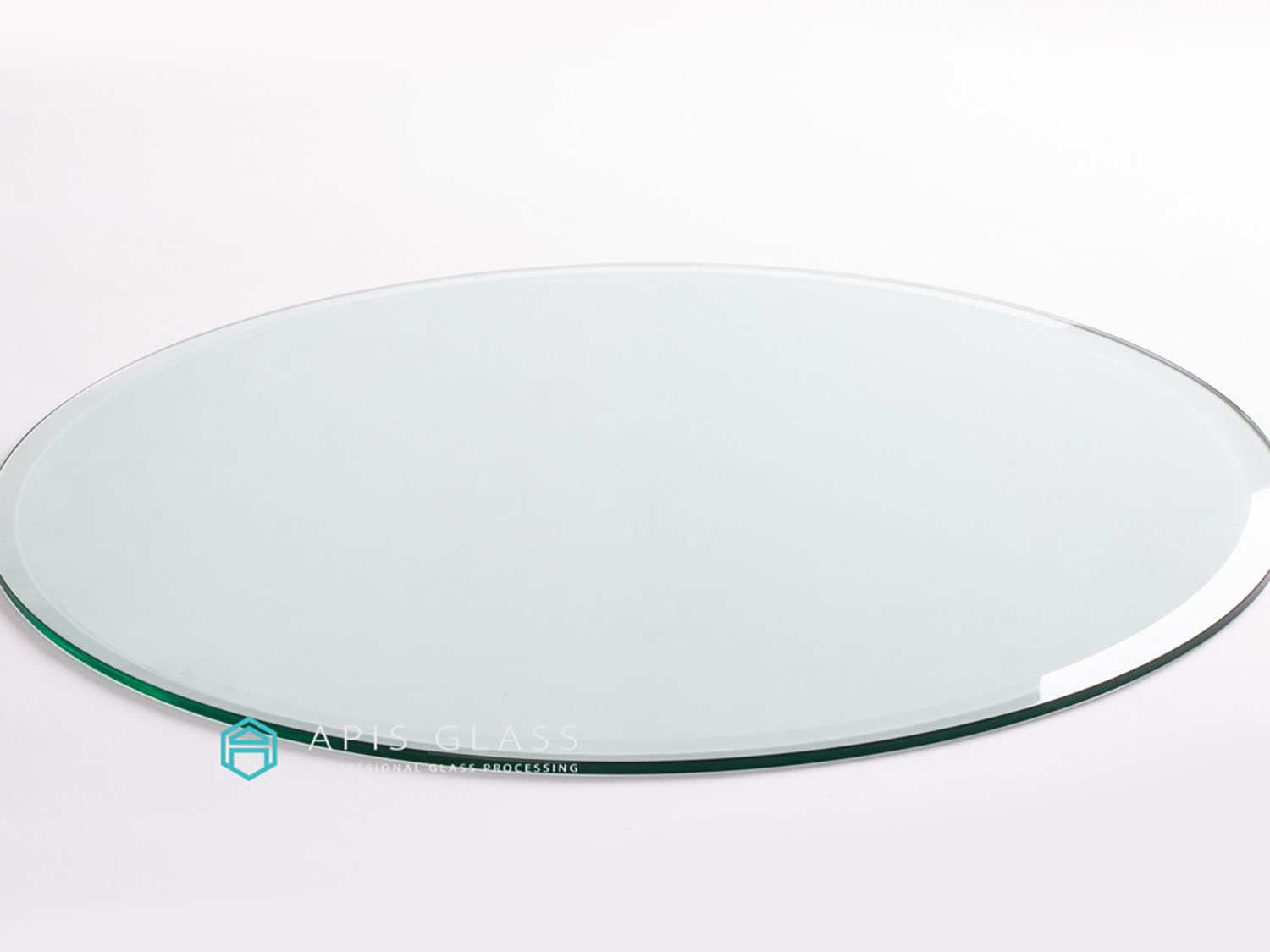 Fabricators of round glass table top with beveled edge Apis Glass