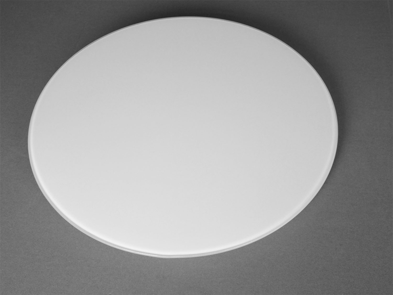 Fabricators of round glass table top with beveled edge Apis Glass
